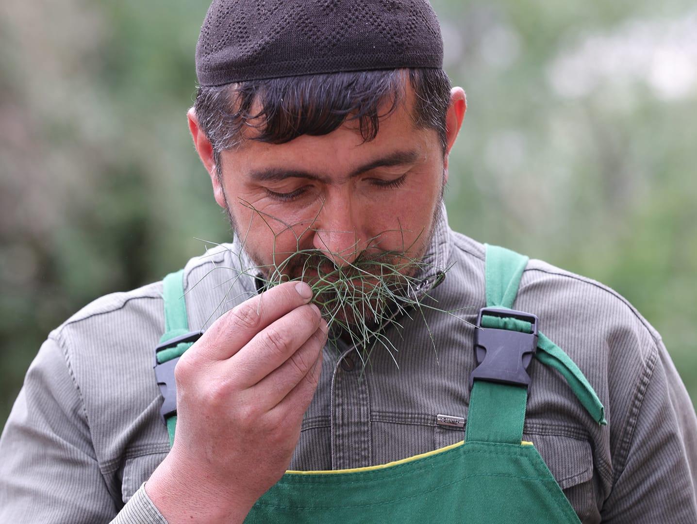 Man smelling herbs