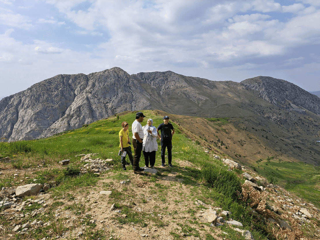 People standing in a mountain landscape