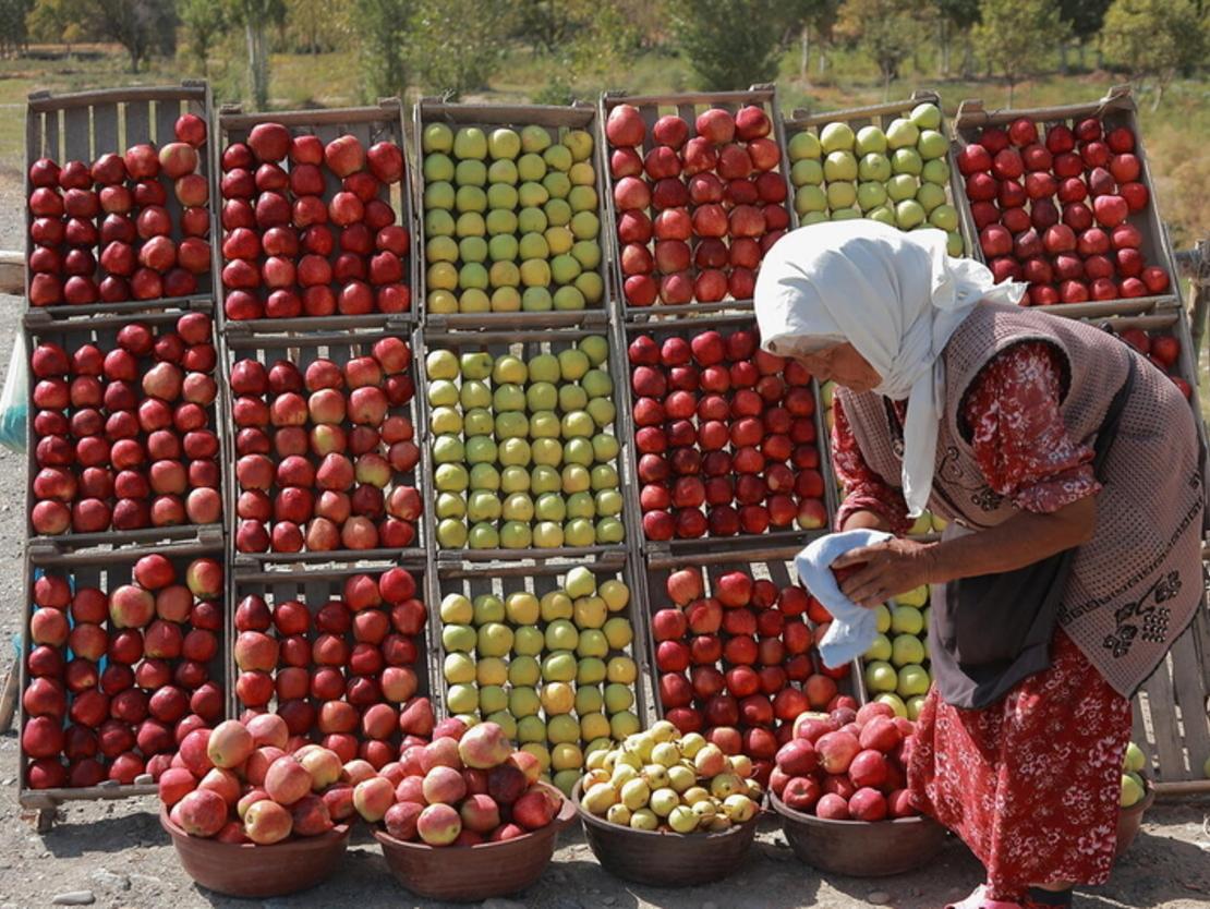 Woman at an apple stand